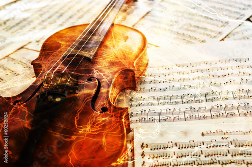  Old violin lying on the sheet of music