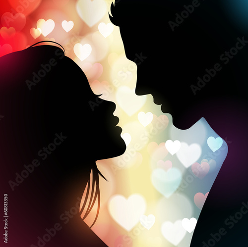 Fototapeta Couple silhouette with hearts in the background