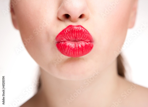  Woman kissing with sexy red lips