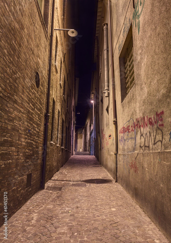 Fototapeta dark alley in the old town