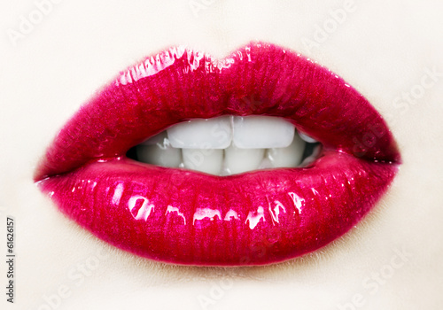 Fototapeta Beautiful female with red shiny lips close up
