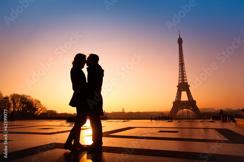 loving couple kissing on Eiffel Tower background, Paris, France