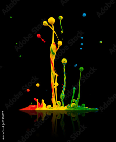  Colored paint splashes on black background
