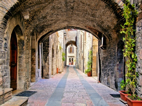 Lacobel Arched medieval street in the town of Assisi, Italy