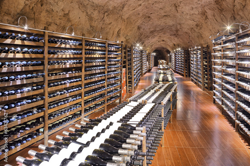 Fototapeta Wine cellar with wine bottle and glasses