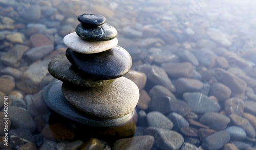  Zen Balancing Rocks on Pebbles Covered with Water