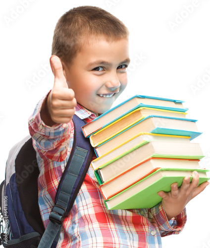Fototapeta Cute boy is holding book