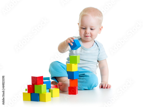 Fototapeta baby toddler playing with building block toys