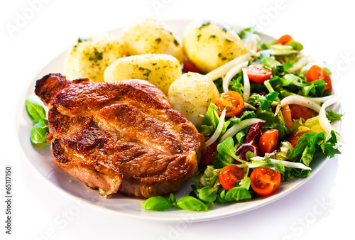 Fototapeta Grilled steak, boiled potatoes and vegetable salad