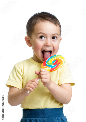 Fototapeta kid boy eating lollipop isolated
