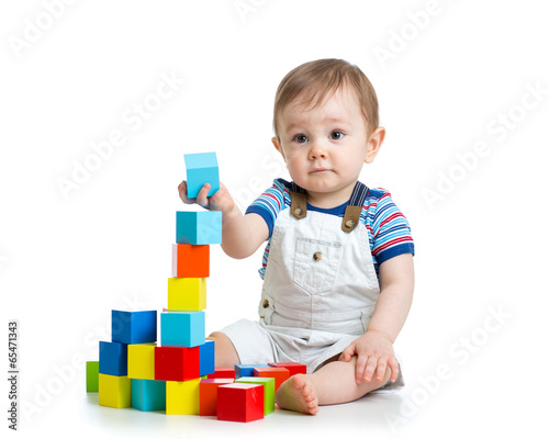 Fototapeta baby toddler playing with building block toys