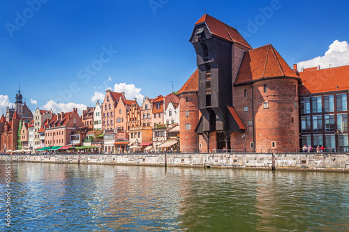 Fototapeta The medieval port crane over Motlawa river in Gdansk, Poland