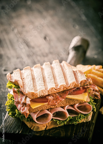 Fototapeta Healthy grilled ham, cheese and salad sandwich