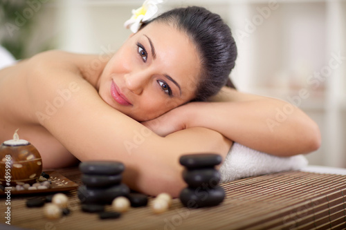 Fototapeta beautiful smiling woman relaxing in spa center
