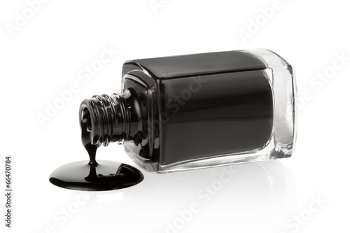 Zdjęcia Black nail polish spilled on white, clipping path