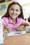 Pre teen girl in <b>art class</b> - 160_F_66525586_1FR0tzxfmJ1y8t9dsogOBiF7y0KCQe5H