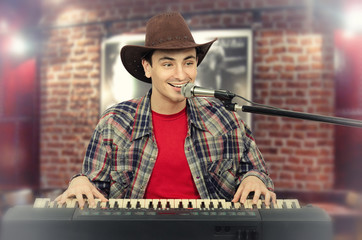 Young handsome cowboy singing
