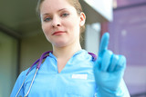 woman doctor in <b>medical gloves</b> - 160_F_69316579_kgeqlXMlMkMdc0EkzzGIOUm84JBVaZyB