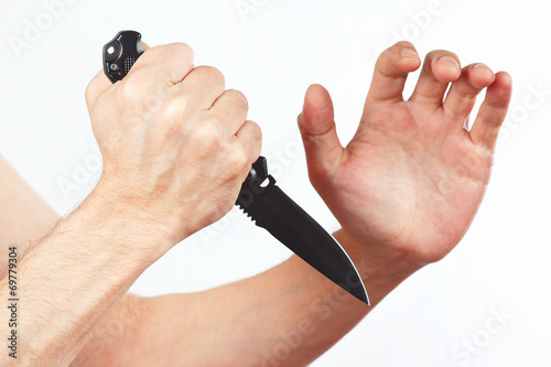 Poster Hand position for defense with a army knife on white background