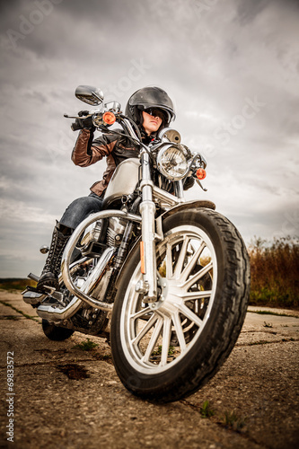 Fototapeta Biker girl on a motorcycle