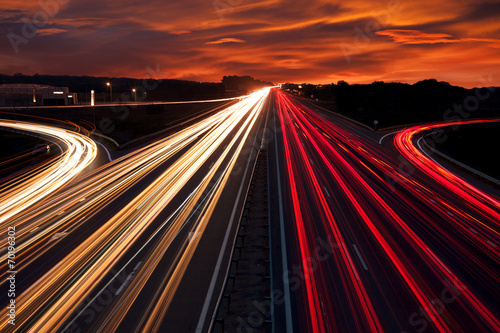 Speed Traffic - light trails on motorway highway at night poster
