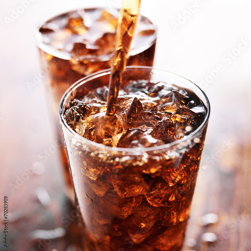 soft drink being poured into glass poster