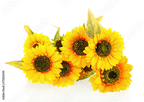 Composition of bright artificial sunflowers on white background.