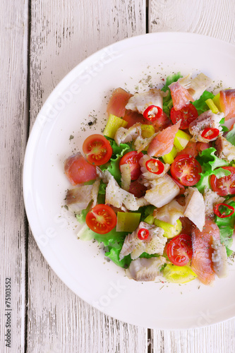Fresh fish salad with vegetables