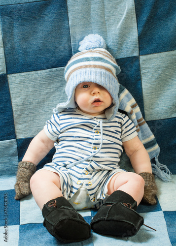Cute baby boy wearing of warm knitted 