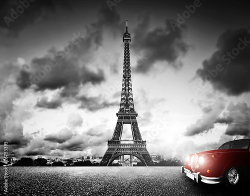 Effel Tower, Paris, France and retro red car. Black and white