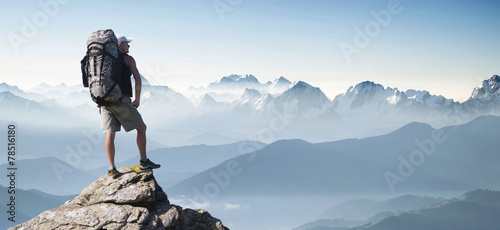 Tourist in mountain peak. Active life concept t-shirt