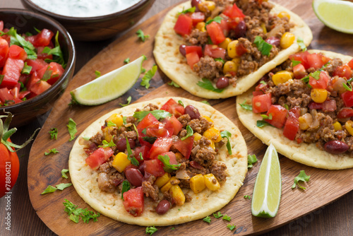 Vászonkép tortillas with chili con carne and tomato salsa on wooden board