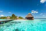 Beach Villas on small tropical island poster