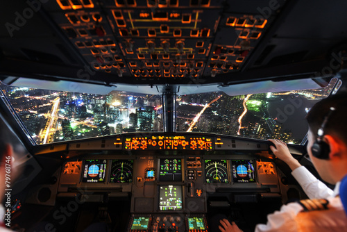 Fototapeta Pilots in the plane cockpit