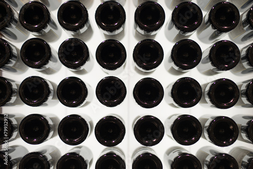 Poster Many wine bottles. Bottom view.