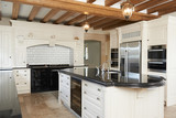 Luxury Fitted Kitchen In House With Beamed Ceiling