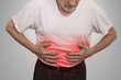 Stomach ache, man placing hands on the abdomen