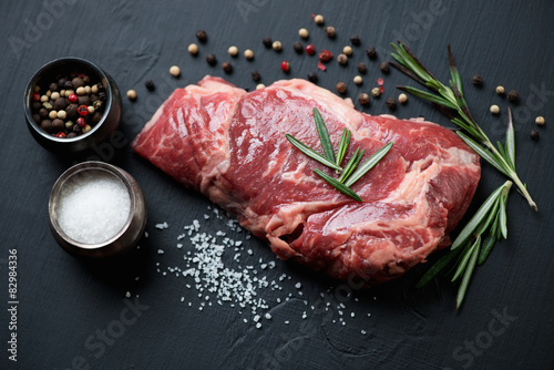 Zdjęcia Raw ribeye steak with seasonings, close-up, studio shot
