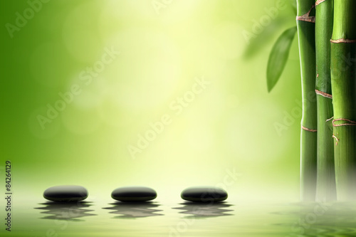  Zen concept. Black spa stones in bamboo forest.