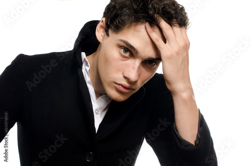 Portrait of a beautiful young man dressed in a black long coat, upset and stressed - 500_F_84478591_9jRnwDAvZYz4cZIdiuJDyC4Jj9GSpw1o