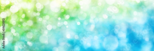 Poster Faits saillants Defocused en format panoramique vert et bleu