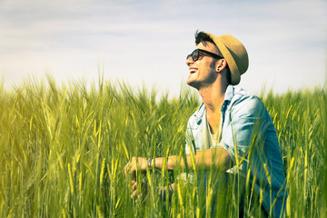 Guy is smiling in the countryside - Emotions, lifestyle and people concept