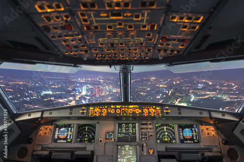 Fototapeta plane cockpit and city of night