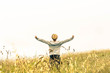 boy expresses his freedom in the countryside - lifestyle concept