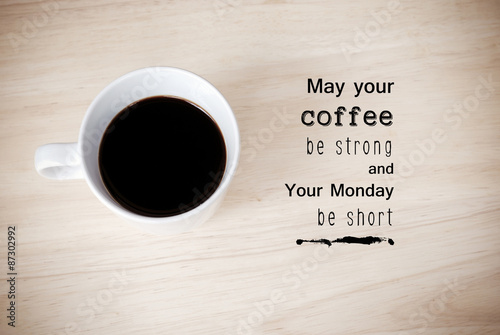 Inspirational quote on coffee cup background
