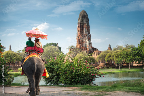 Poster Tourists on an elephant ride tour of the ancient city Ayutaya ,thailand