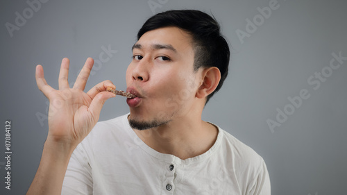 Asian man with chicken bone.