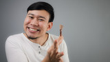 Asian man with chicken bone.