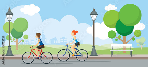 Couple Riding Bicycles In Public Park