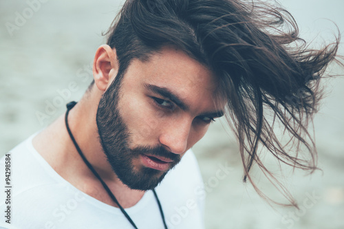 Poster Portrait of a man with beard and modern hairstyle